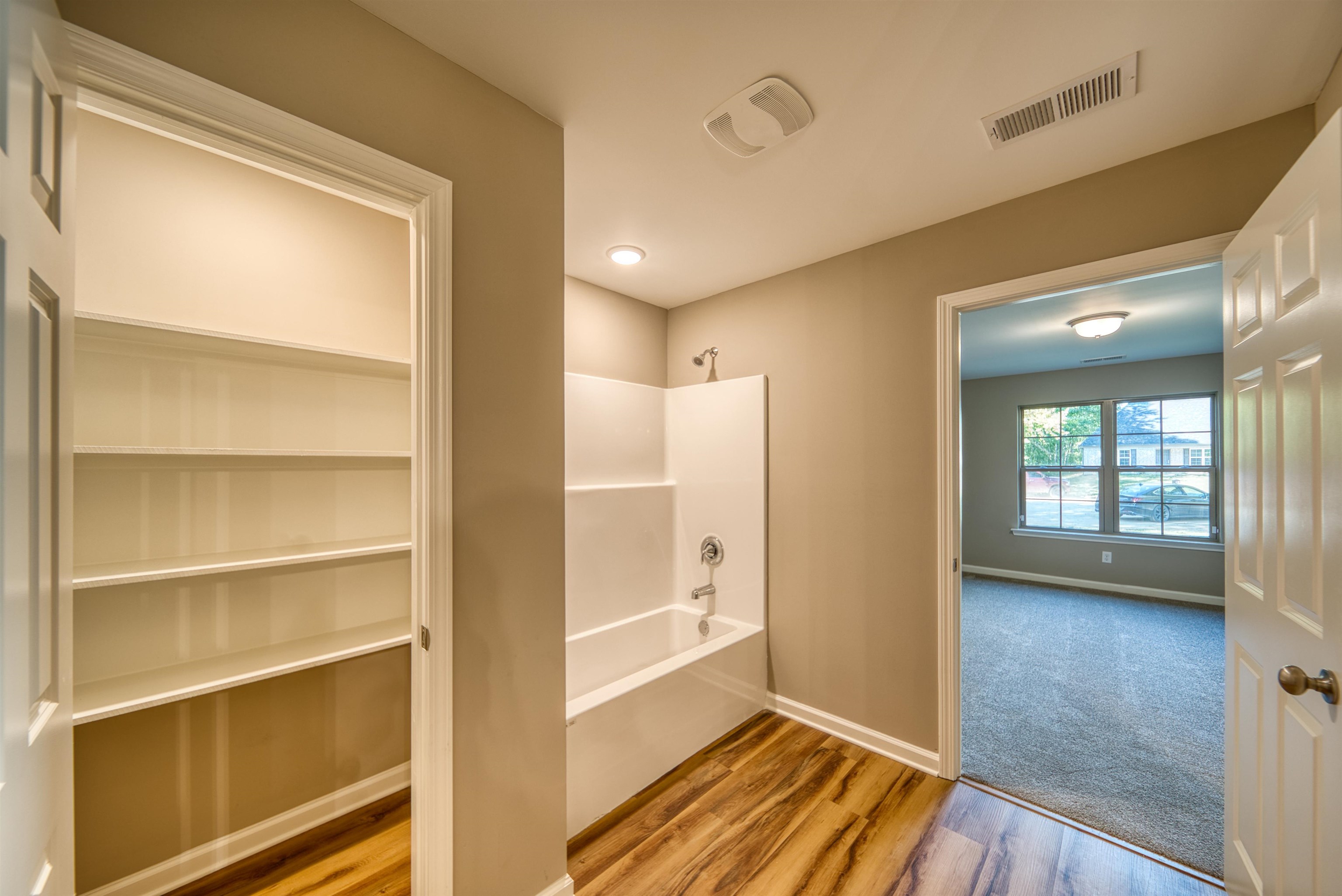 109 Walnut Ridge Ripley, TN 38063 - Photo 5 of 39 a view of a room with wooden floor and windows