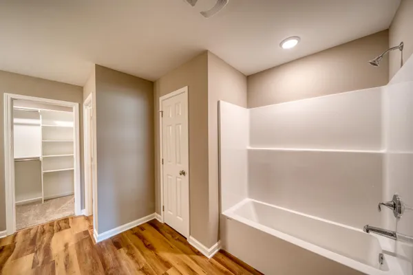 an empty room with a empty space and windows