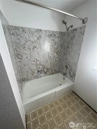 a bathroom with a bathtub