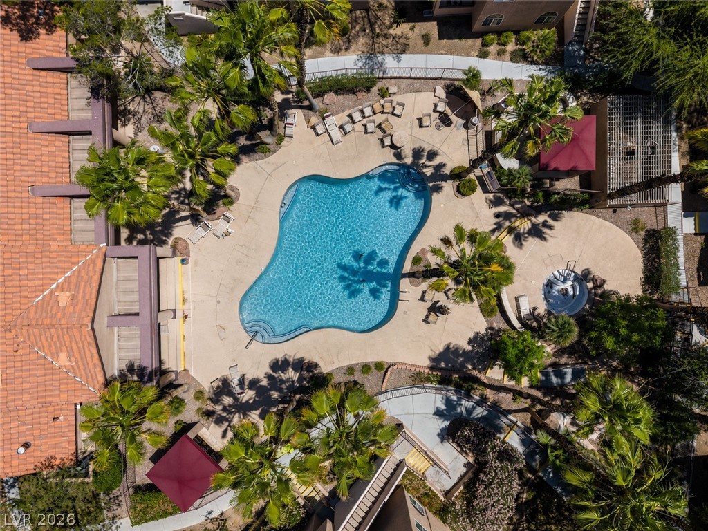 9325 West Desert Inn Road, Unit 244 Las Vegas, NV 89117 - Photo 53 of 55 An aerial view captures the inviting pool area, complete with a spa and ample space for lounging.
