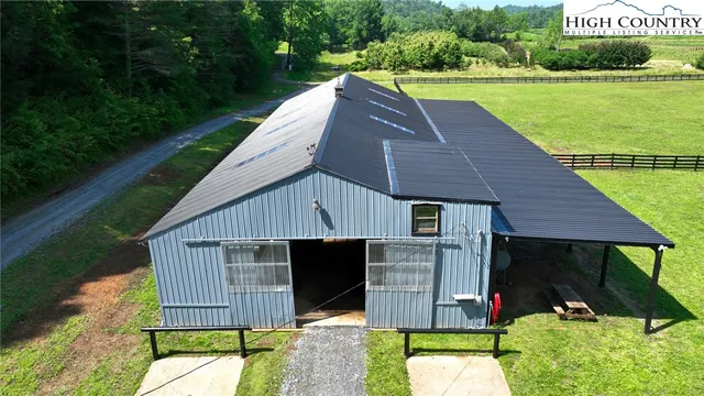 a aerial view of a house with table and chairs