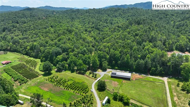 a backyard of a house with a yard and outdoor seating