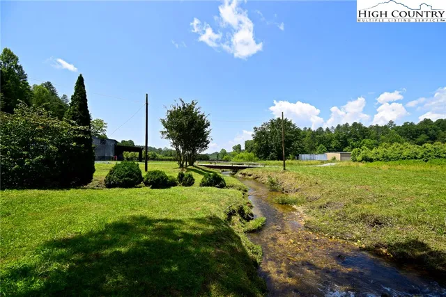 a view of a golf course with a lake view