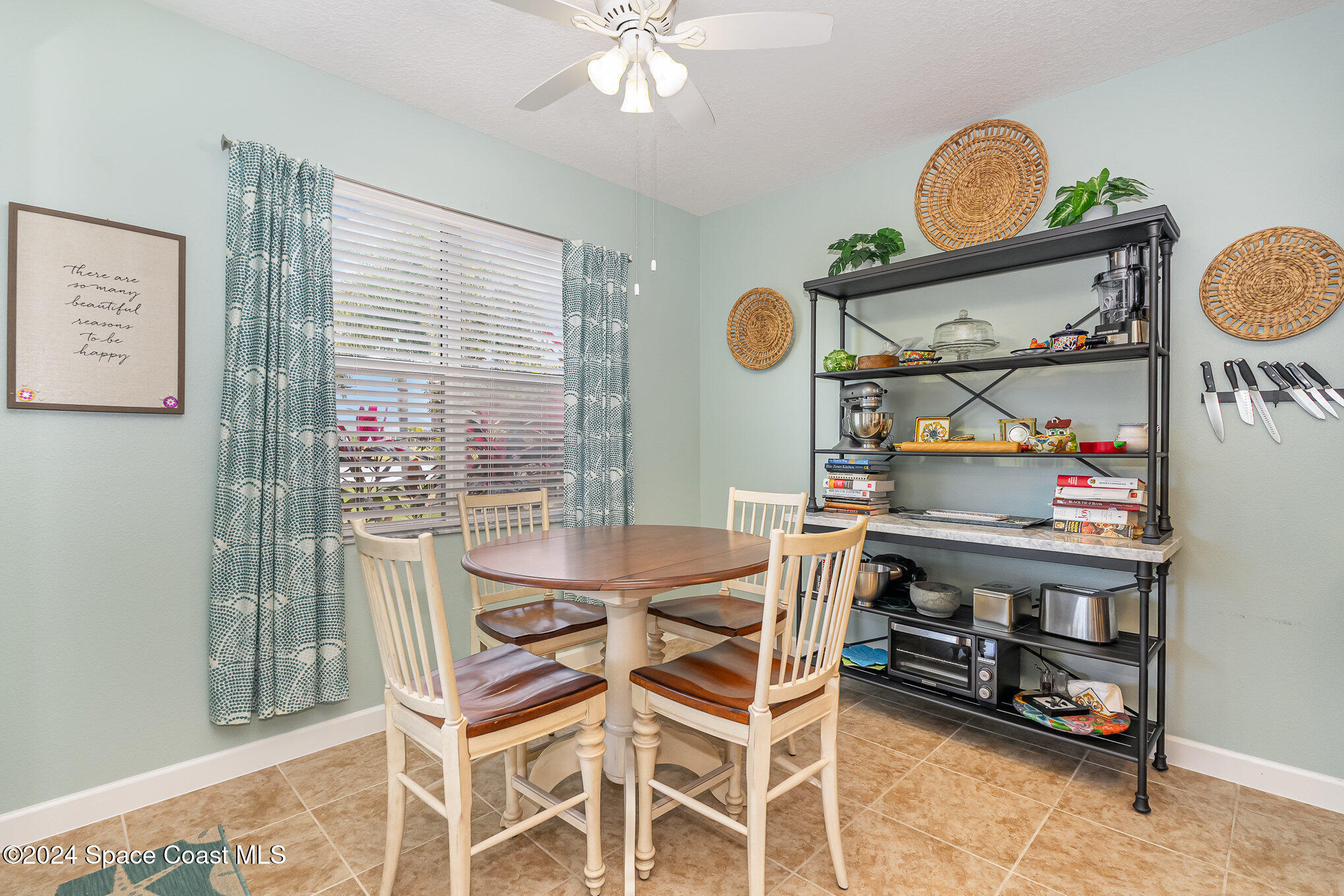 3354 Sansome Circle Melbourne, FL 32940 - Photo 14 of 81 a view of a dining room with furniture and chandelier