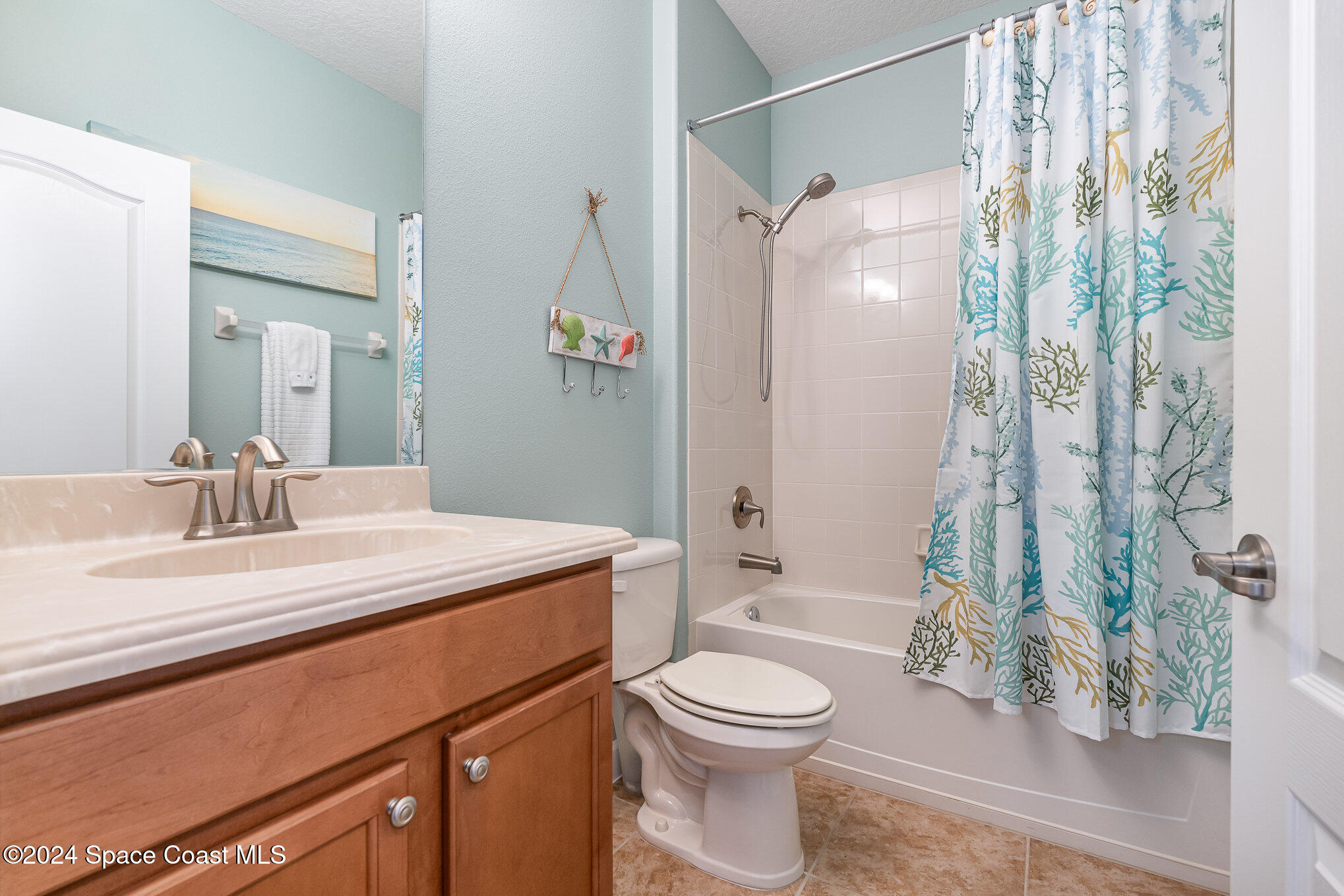 3354 Sansome Circle Melbourne, FL 32940 - Photo 21 of 81 a bathroom with a sink a toilet and shower