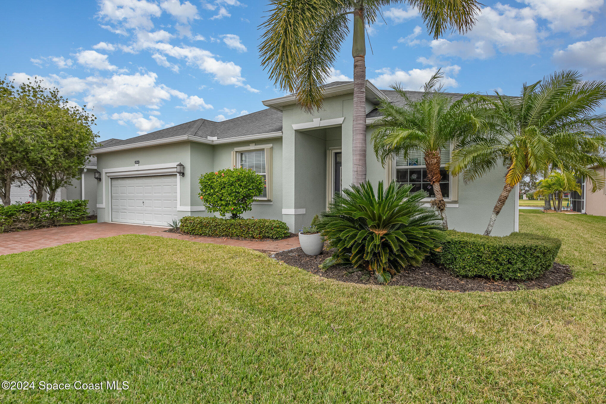 3354 Sansome Circle Melbourne, FL 32940 - Photo 4 of 81 a front view of house with yard and green space