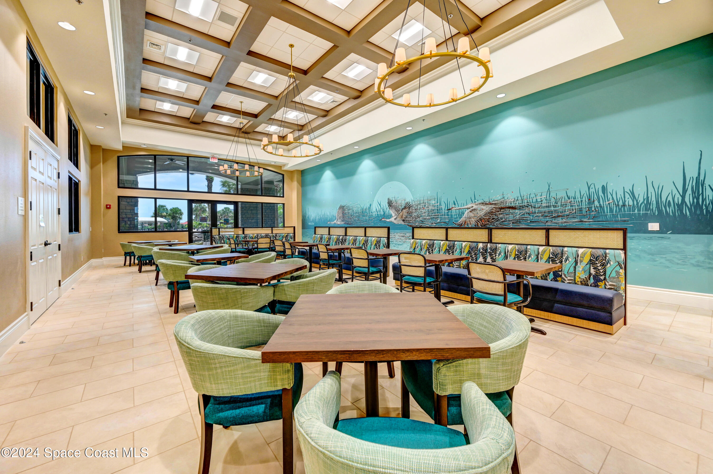 3354 Sansome Circle Melbourne, FL 32940 - Photo 46 of 81 a outdoor space with lots of tables a chairs and a barbeque