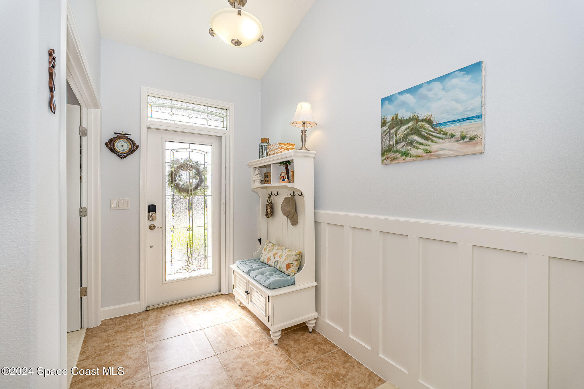 3354 Sansome Circle Melbourne, FL 32940 - Photo 5 of 81 a spacious bedroom with a bed and a chandelier