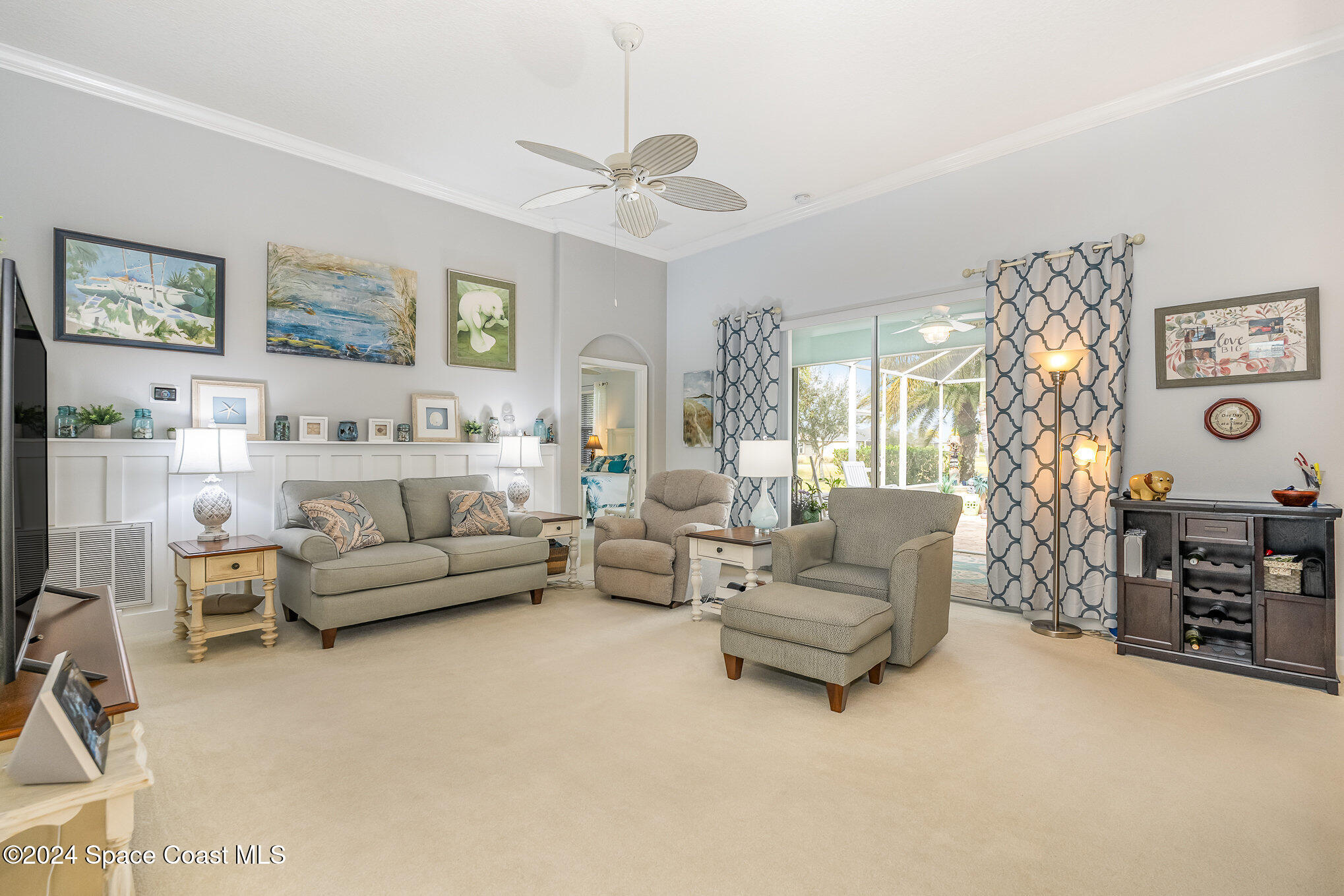 3354 Sansome Circle Melbourne, FL 32940 - Photo 9 of 81 a living room with furniture and a flat screen tv