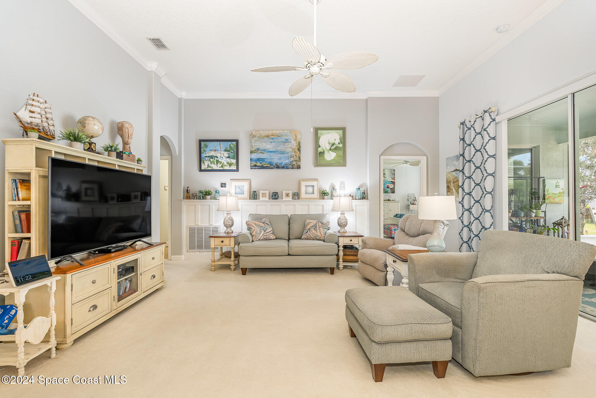 3354 Sansome Circle Melbourne, FL 32940 - Photo 10 of 81 a living room with furniture and a flat screen tv