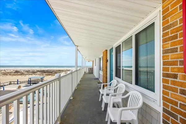 a view of a balcony with furniture