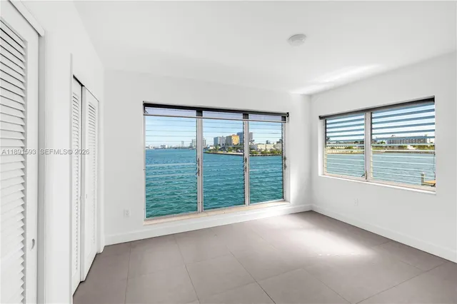 a view of an empty room with a large window