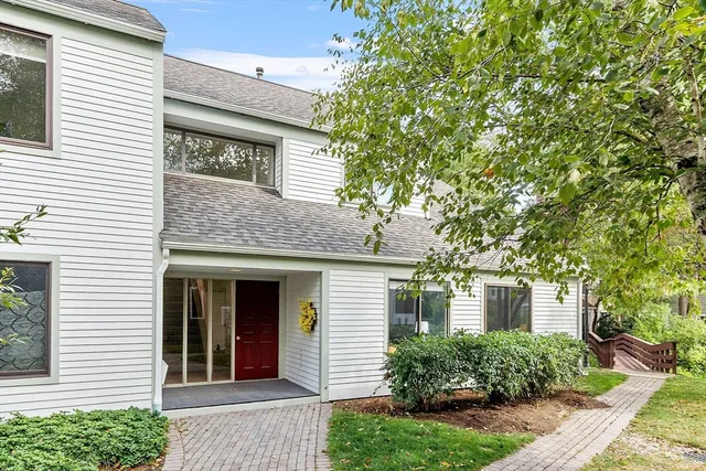 a view of a house with a tree