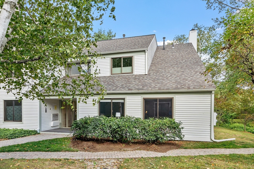 1 Concord Greene, Unit 7 Concord, MA 01742 - Photo 2 of 31 front view of a house with a yard