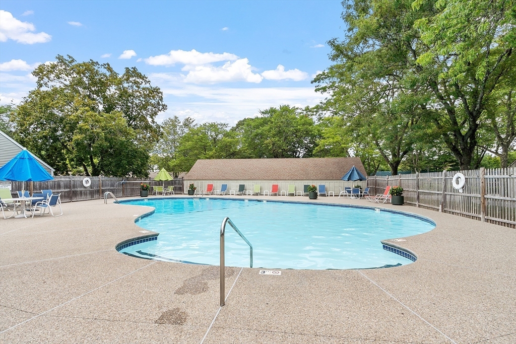 1 Concord Greene, Unit 7 Concord, MA 01742 - Photo 28 of 31 a view of a swimming pool with a patio