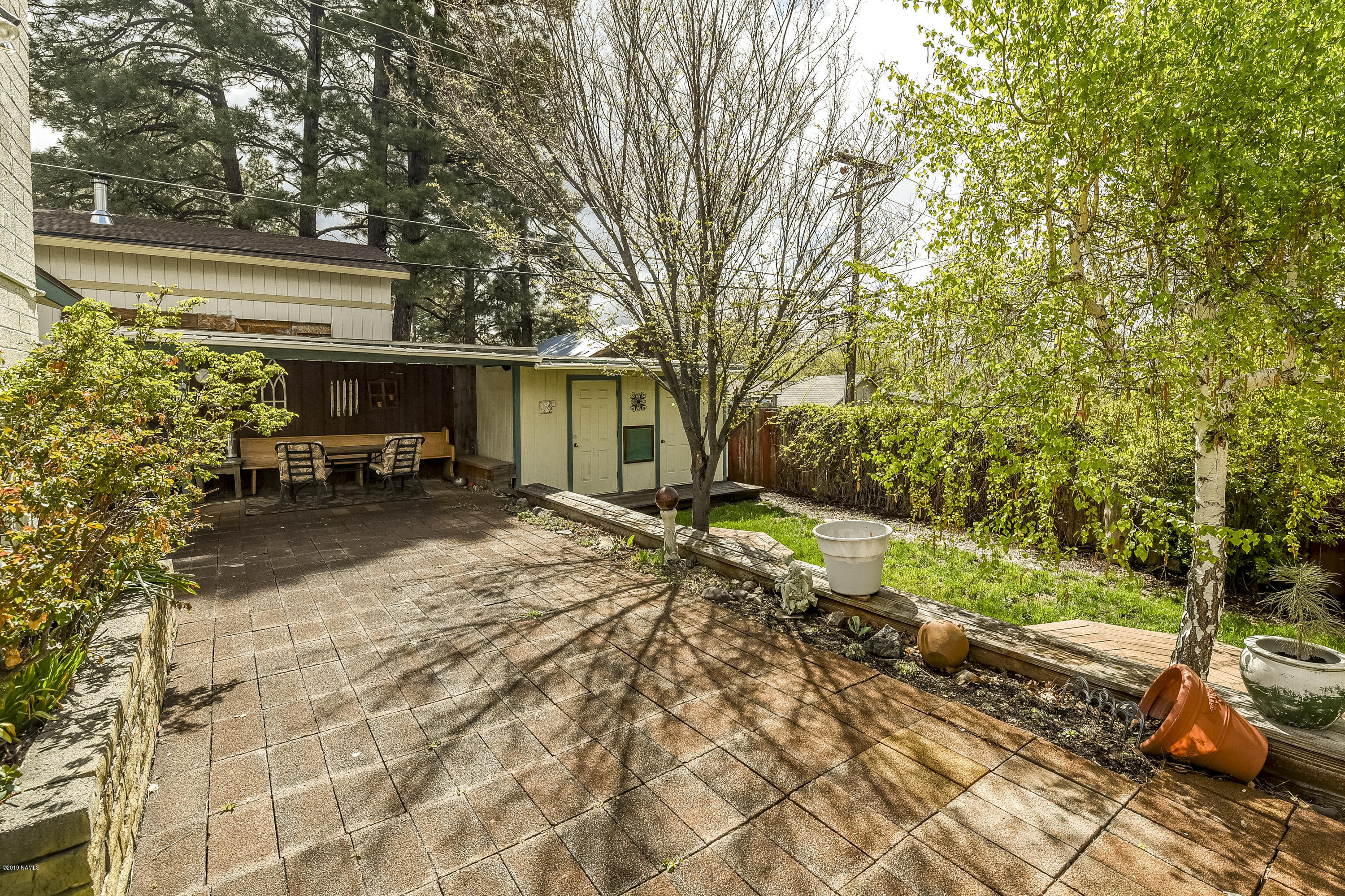 2435 East Lockett Road Flagstaff, AZ 86004 - Photo 23 of 25 Backyard with 2 sheds