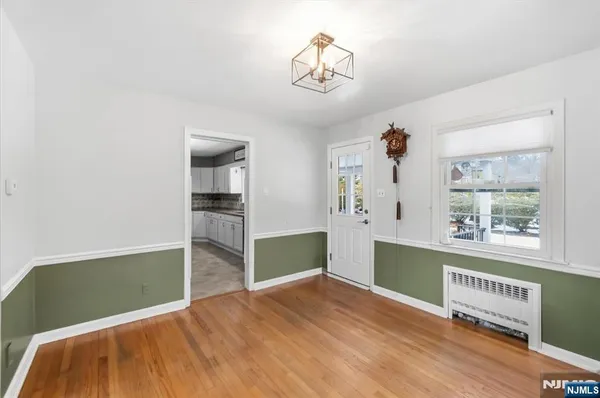 a kitchen with granite countertop a refrigerator oven a sink and dishwasher