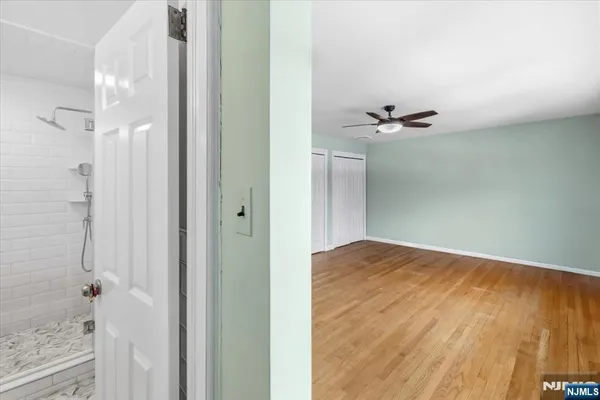 a view of an empty room with a window