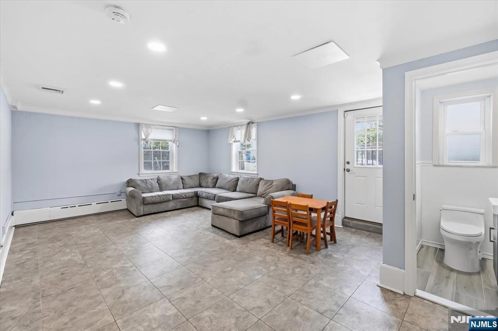 922 Wildwood Road Oradell, NJ 07649 - Photo 25 of 42 a living room with furniture and a window