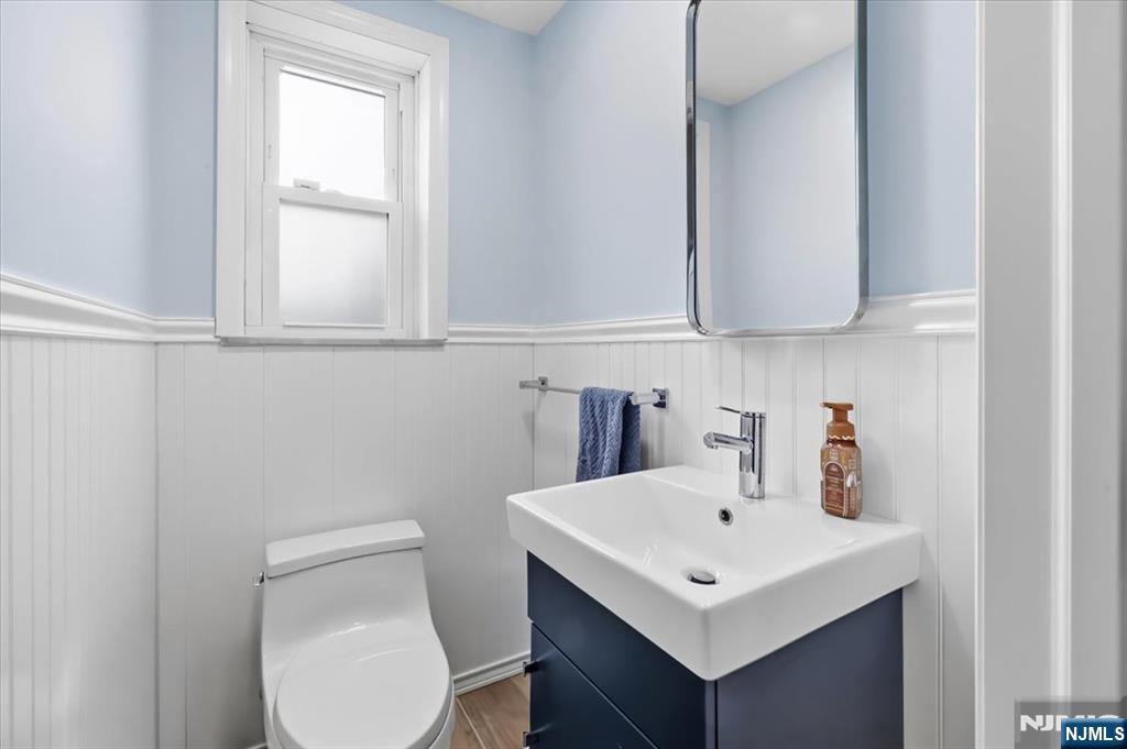 922 Wildwood Road Oradell, NJ 07649 - Photo 26 of 42 a bathroom with a sink a toilet and vanity