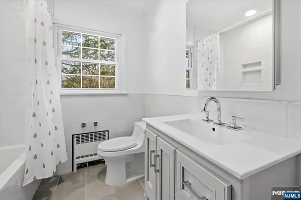 a view of a house with glass door and deck