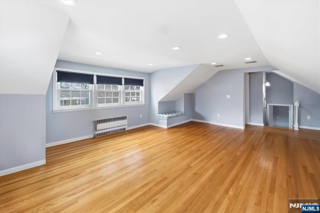 922 Wildwood Road Oradell, NJ 07649 - Photo 28 of 42 an empty room with wooden floor and windows