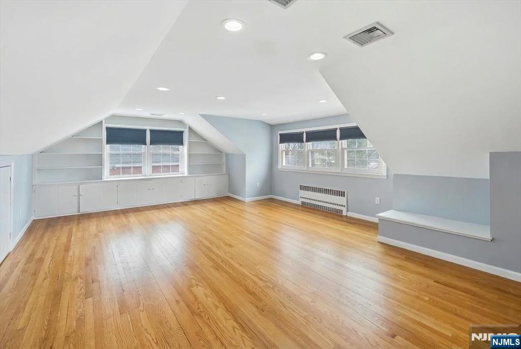 922 Wildwood Road Oradell, NJ 07649 - Photo 30 of 42 an empty room with wooden floor and windows
