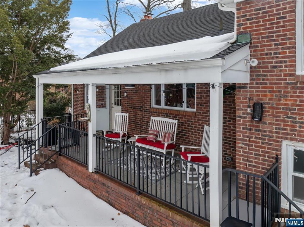 922 Wildwood Road Oradell, NJ 07649 - Photo 32 of 42 a view of a house with glass door and deck
