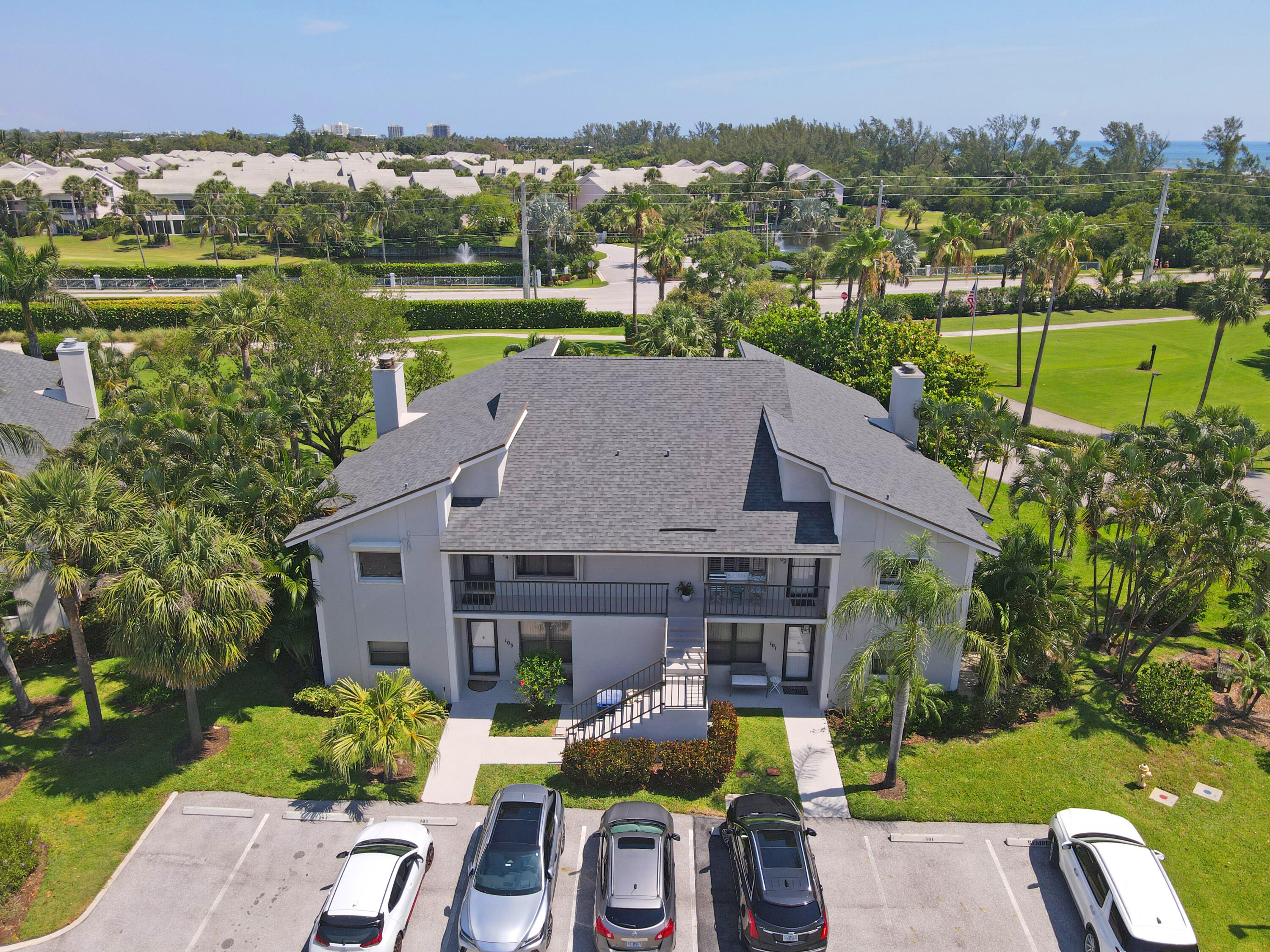 102 Clubhouse Circle Jupiter, FL 33477 - Photo 2 of 35 an aerial view of a house with garden space and outdoor seating