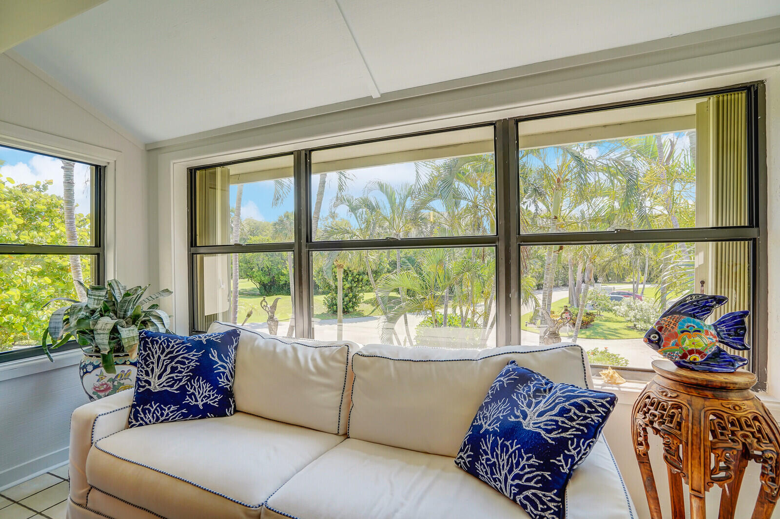 102 Clubhouse Circle Jupiter, FL 33477 - Photo 23 of 35 a living room with furniture and a large window