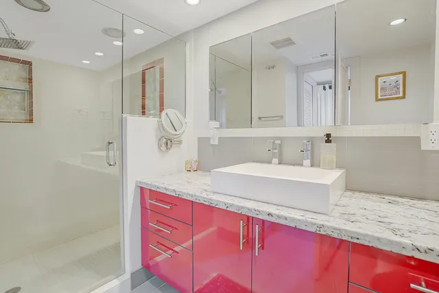 a bathroom with a sink and a mirror