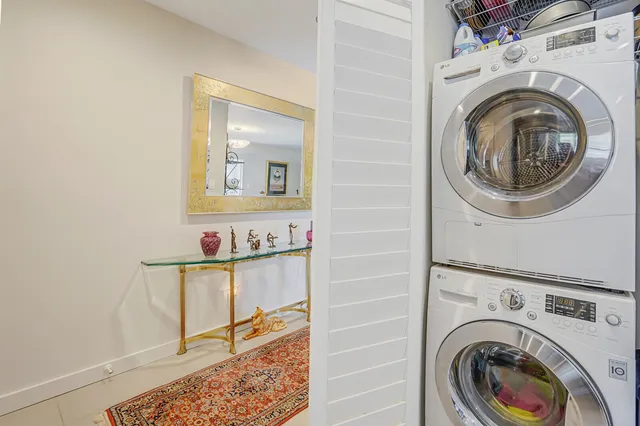 a view of a storage and utility room with washer and dryer
