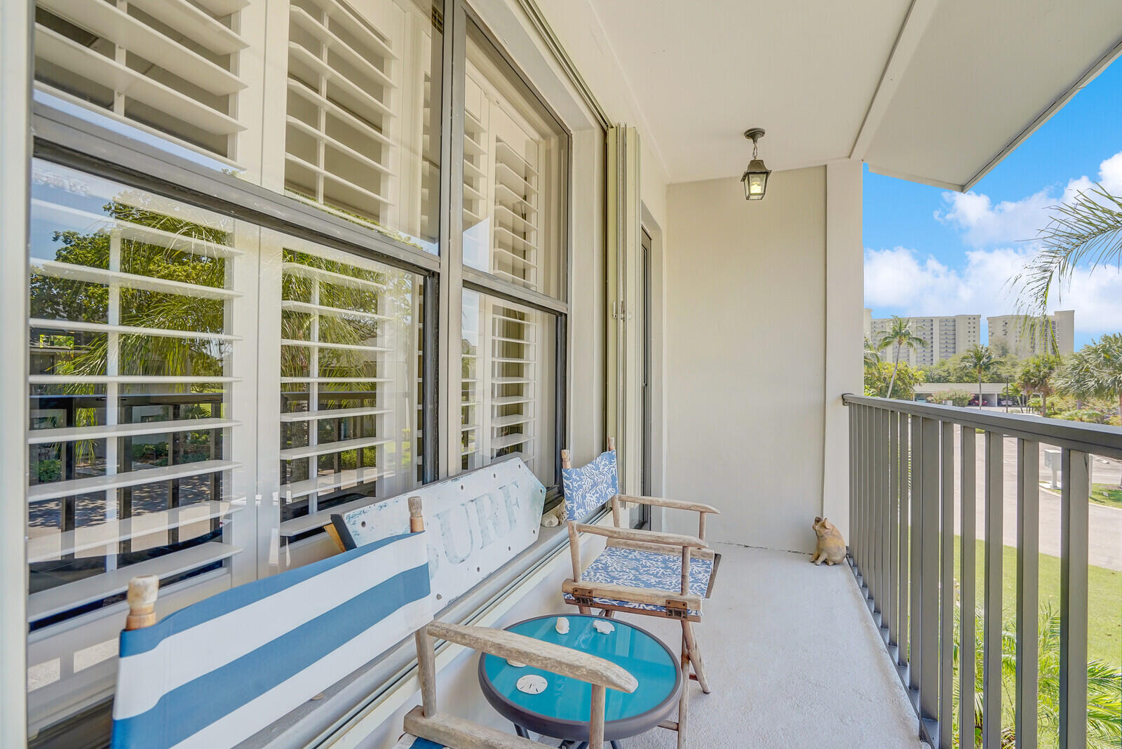 102 Clubhouse Circle Jupiter, FL 33477 - Photo 10 of 35 a living room with furniture and a large window