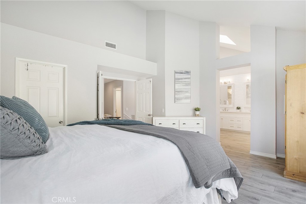 2865 Riachuelo San Clemente, CA 92673 - Photo 17 of 35 a spacious bedroom with a bed and a couch