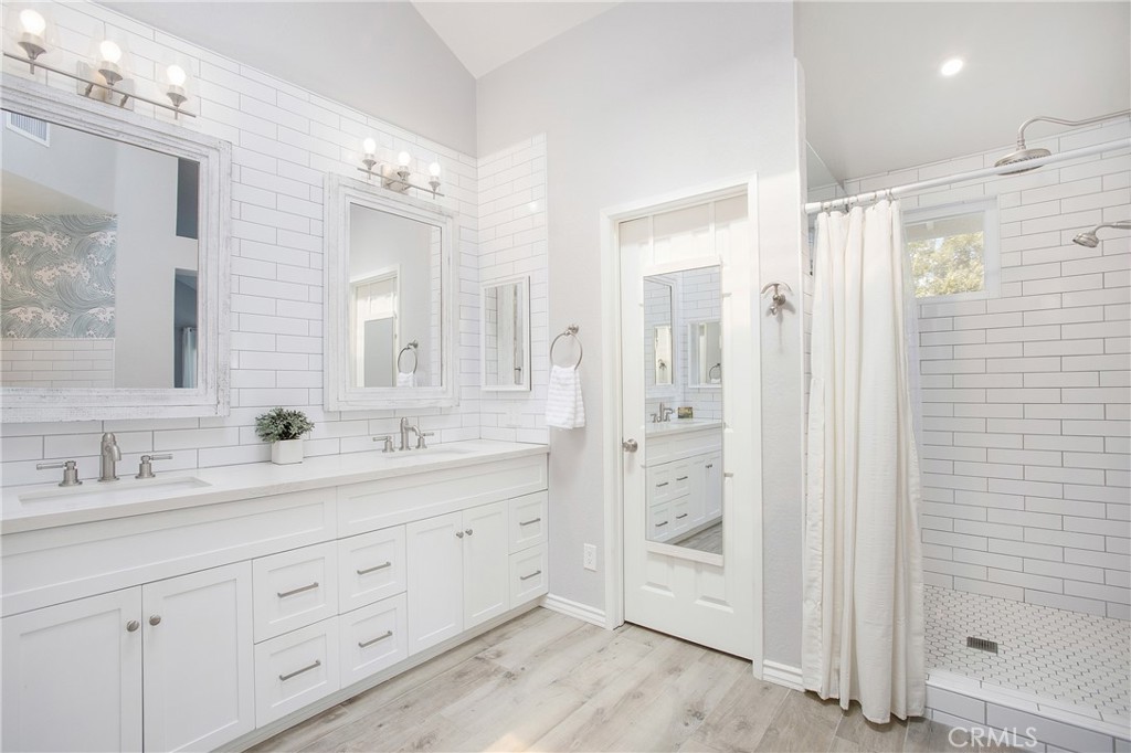 2865 Riachuelo San Clemente, CA 92673 - Photo 18 of 35 a bathroom with a double vanity sink mirror and shower