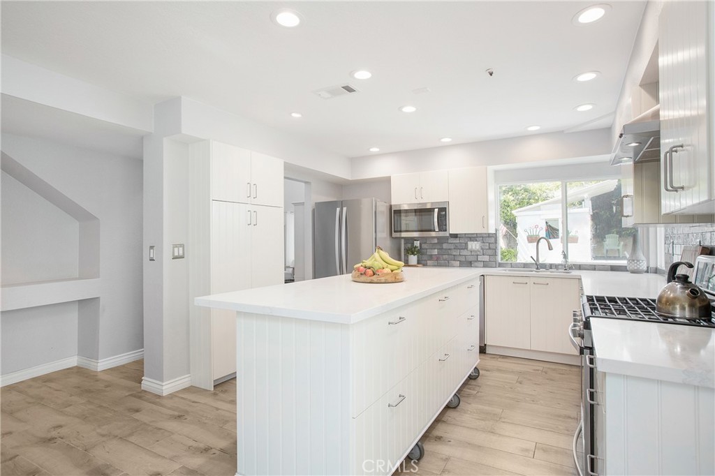 2865 Riachuelo San Clemente, CA 92673 - Photo 8 of 35 a kitchen with a sink a stove cabinets and refrigerator