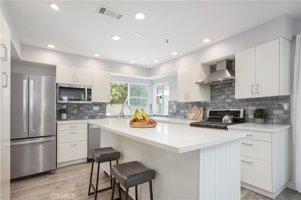 2865 Riachuelo San Clemente, CA 92673 - Photo 9 of 35 a kitchen with stainless steel appliances a refrigerator sink and cabinets