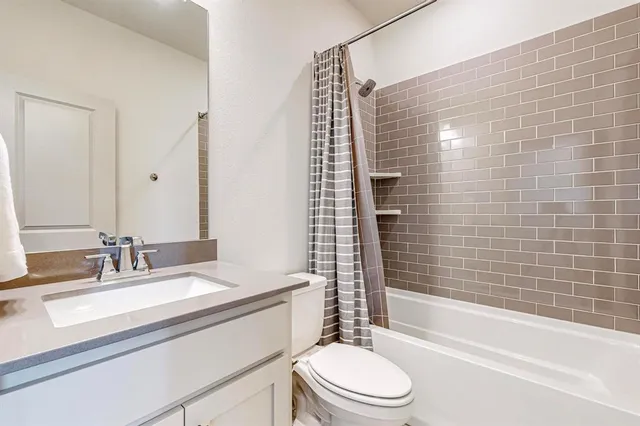 a kitchen with appliances a sink and cabinets