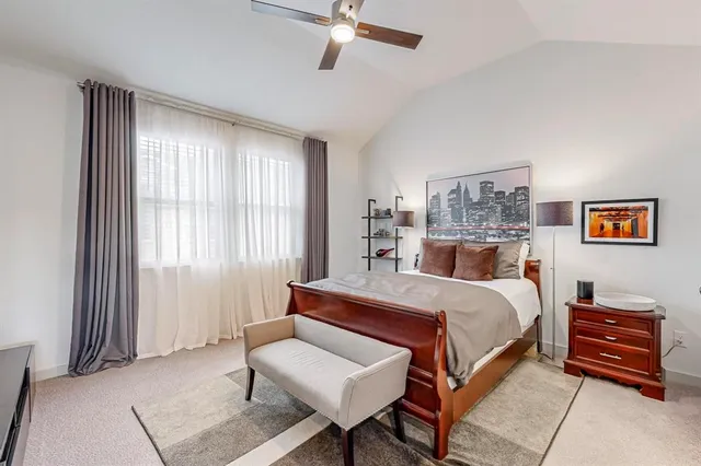 a bedroom with a bed and flat screen tv