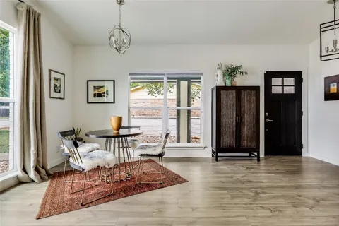 a living room with furniture window and wooden floor