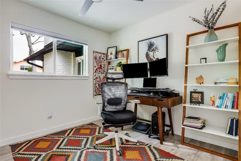 a work room with furniture and book shelf