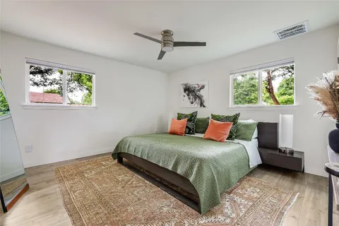 a bedroom with a bed and a couch