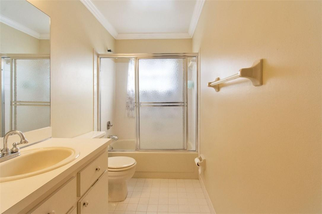 19554 Sea Pines Way Boca Raton, FL 33498 - Photo 14 of 26 a bathroom with a granite countertop sink toilet and shower
