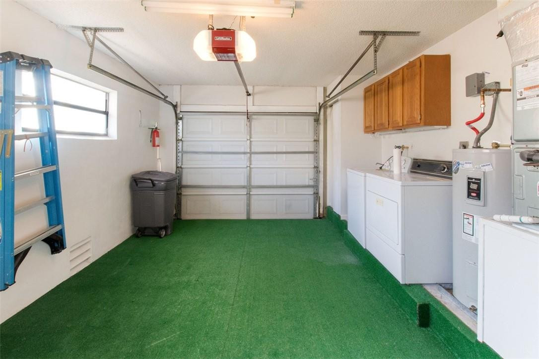 19554 Sea Pines Way Boca Raton, FL 33498 - Photo 21 of 26 a view of a storage & utility room with washer and dryer