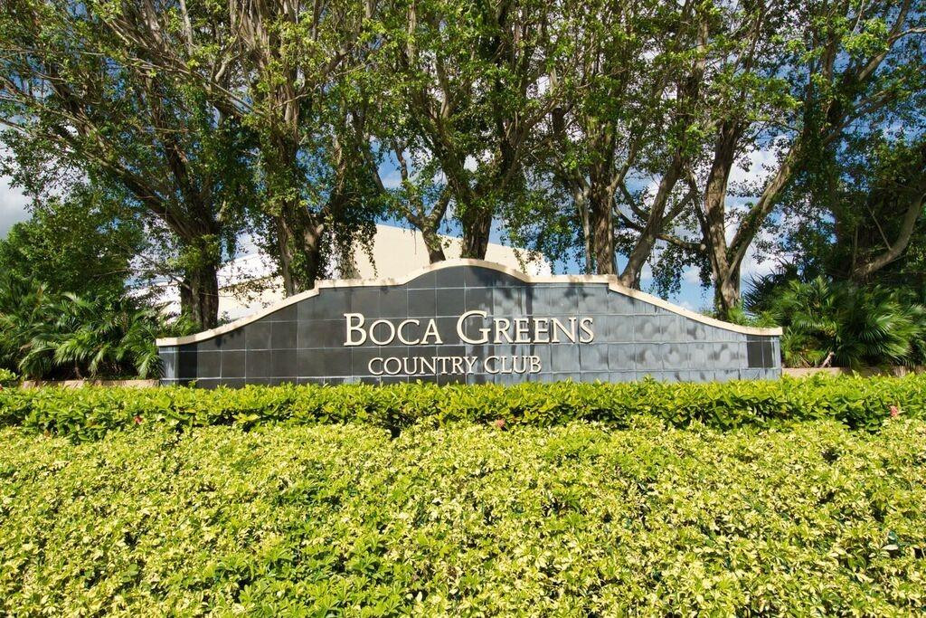 19554 Sea Pines Way Boca Raton, FL 33498 - Photo 24 of 26 a front view of a house with a yard