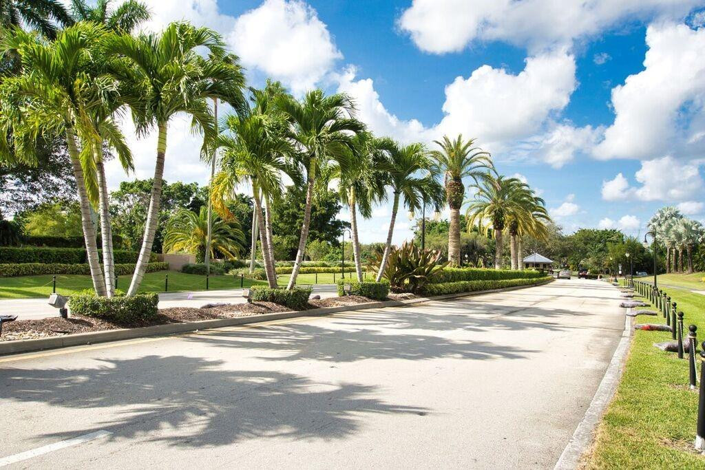 19554 Sea Pines Way Boca Raton, FL 33498 - Photo 25 of 26 a view of a park with swings and slides