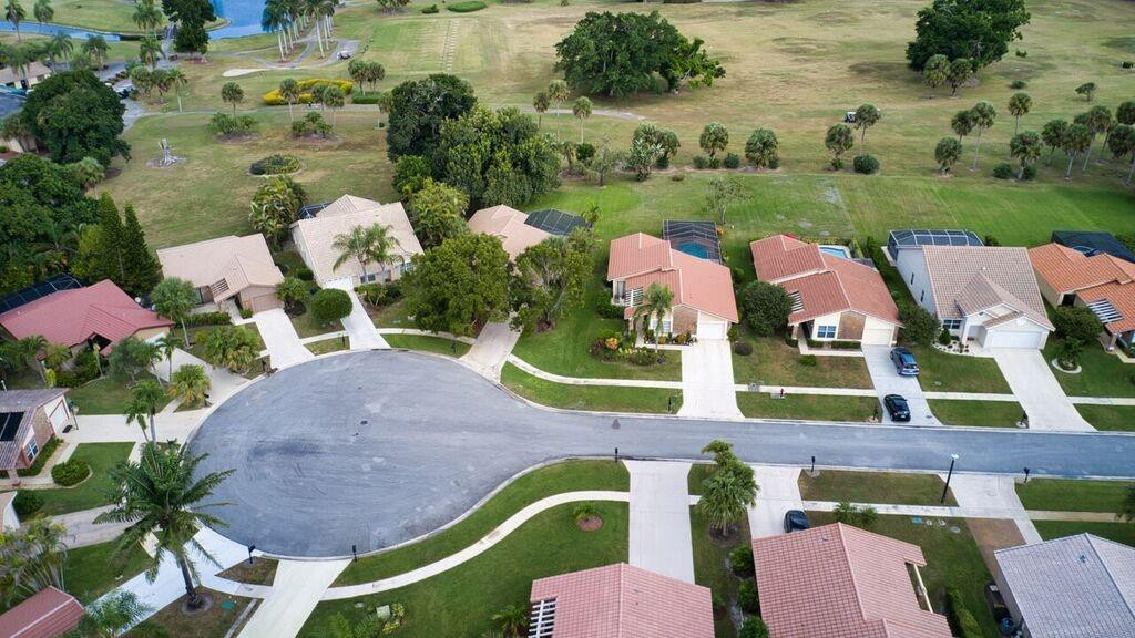19554 Sea Pines Way Boca Raton, FL 33498 - Photo 26 of 26 an aerial view of multiple houses with yard