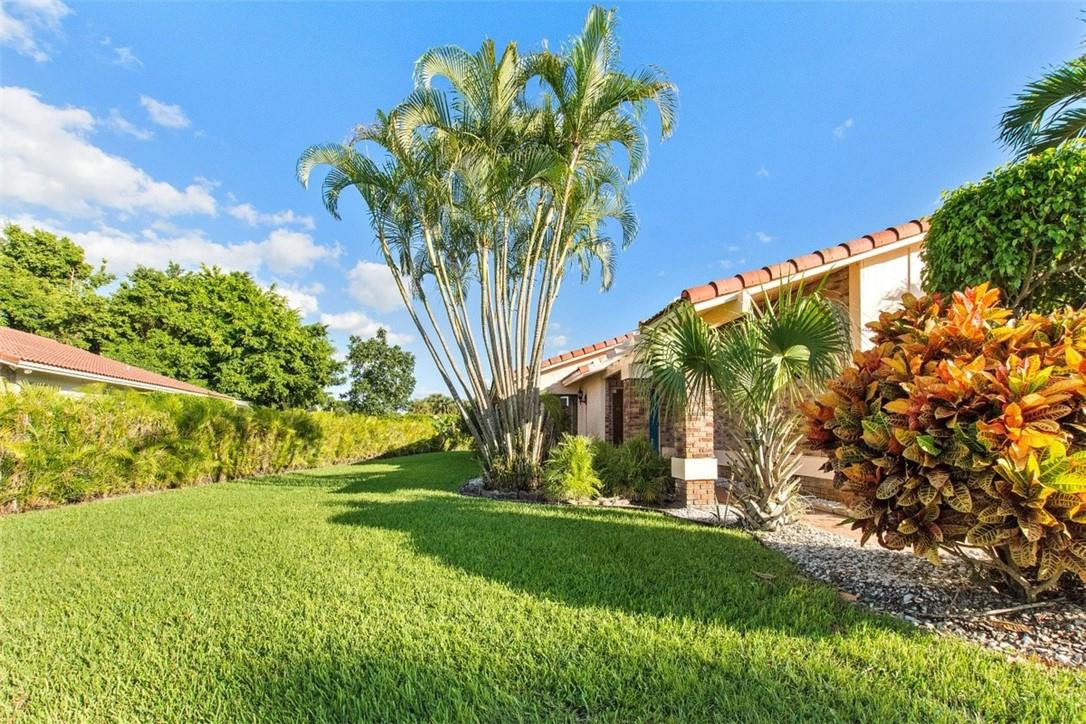 19554 Sea Pines Way Boca Raton, FL 33498 - Photo 4 of 26 a view of a yard with a tree