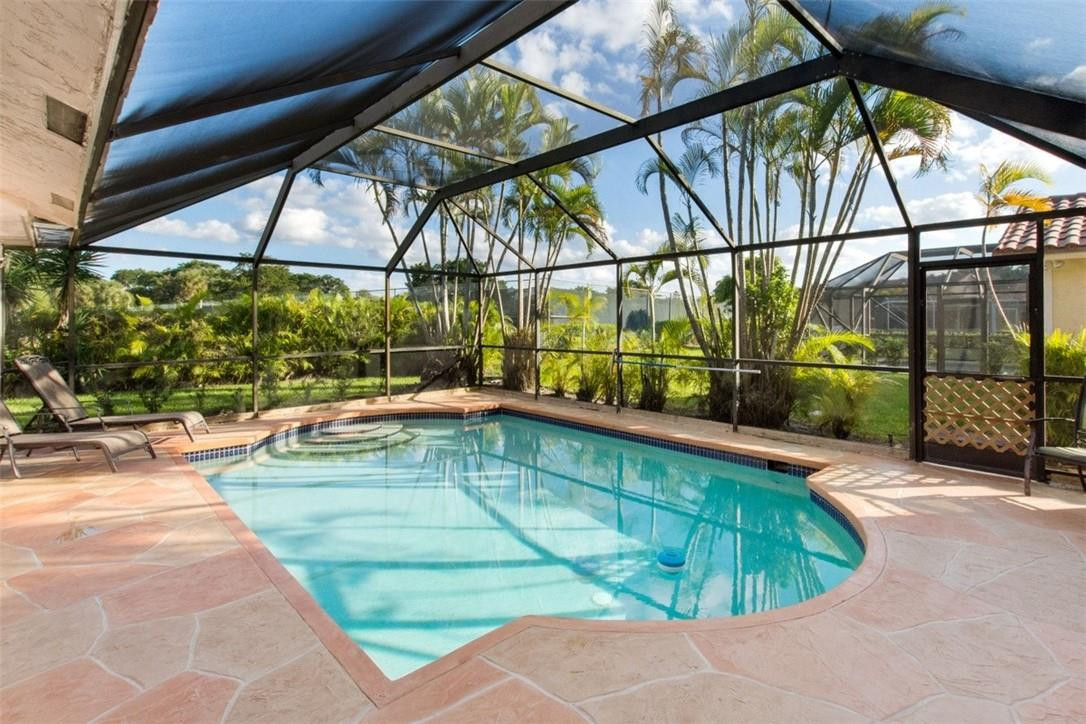19554 Sea Pines Way Boca Raton, FL 33498 - Photo 6 of 26 a view of a swimming pool with a patio