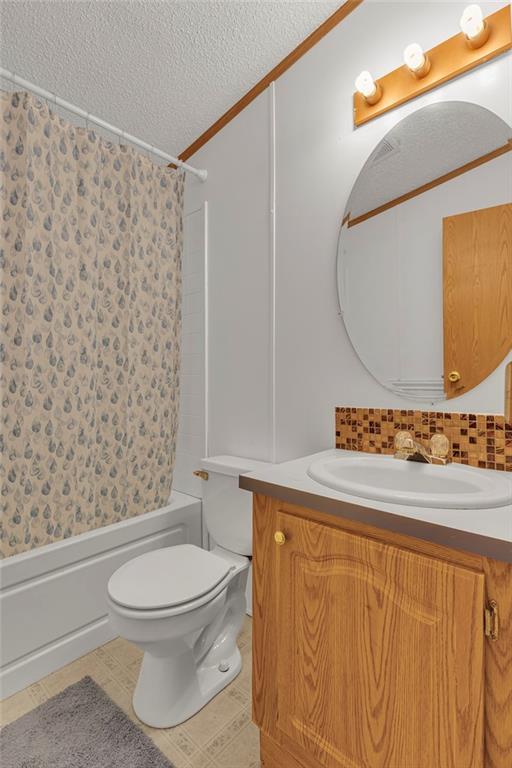 204 Hollowvue Road Wampum, PA 16157 - Photo 16 of 39 a bathroom with a toilet a sink and a bathtub